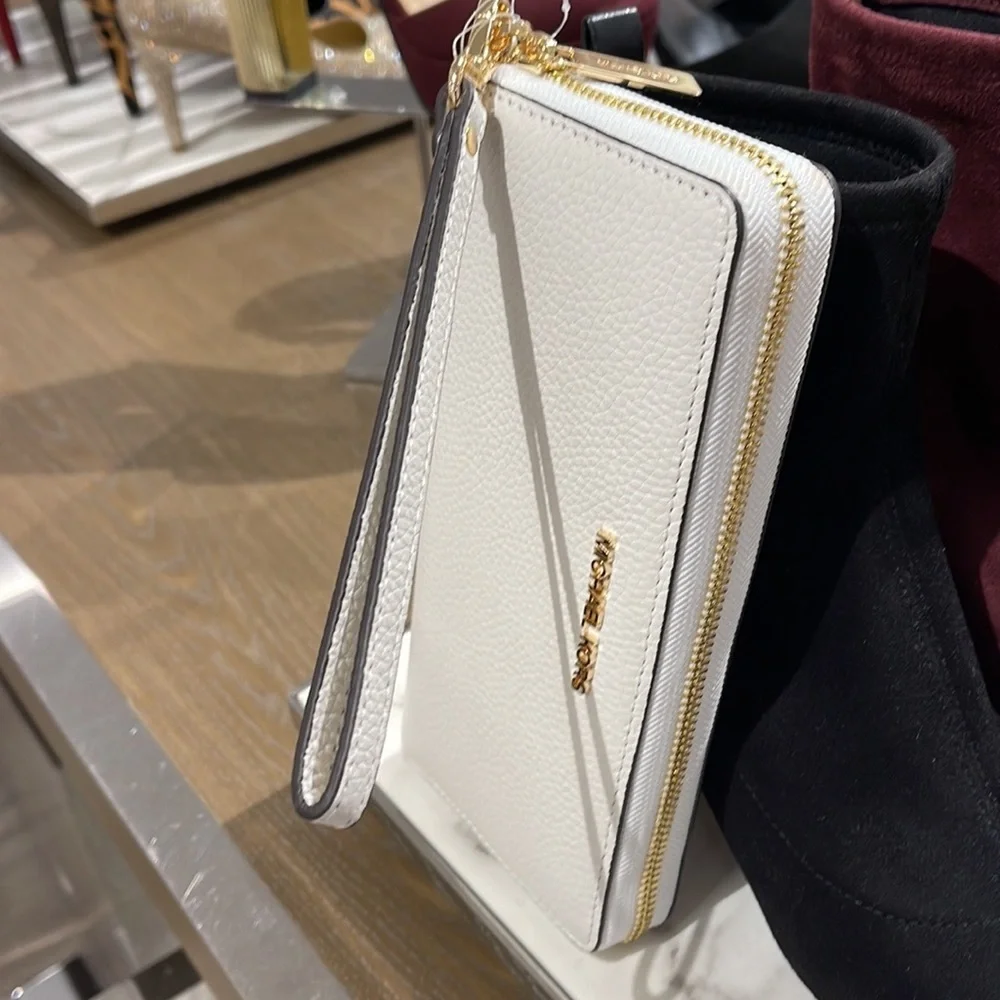 MICHAEL KORS LARGE TRAVEL CONTINENTAL WRISTLET WALLET OPTIC WHITE COLOR